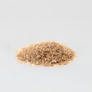 A little pile of coarse wheat bran on a white background